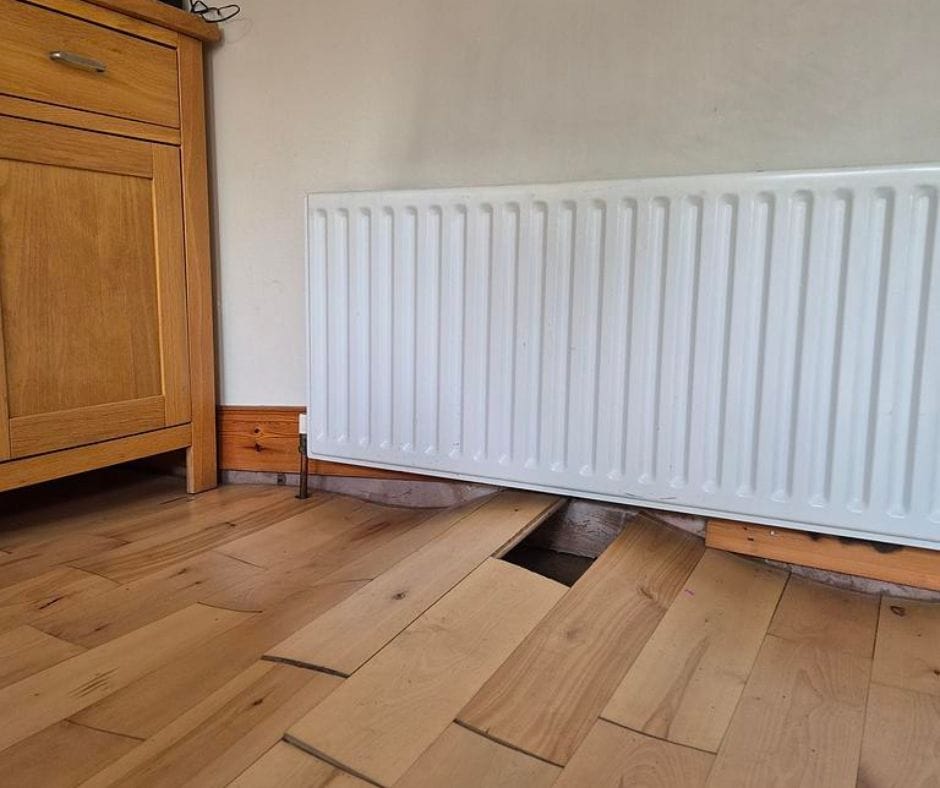 floor damage caused by an underfloor leak in Northern Ireland